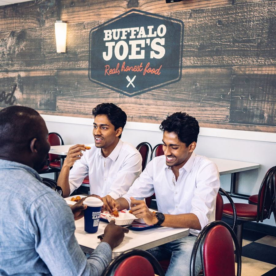 Students enjoying their Food at Buffalo Joe's restaurant